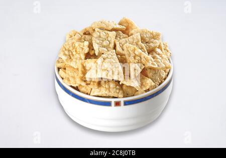 Deep fried Khichiya Papad, Traditional Indian Snacks, Indian crunchy fried snack papad or Papadam made of rice floor served in a plate. Also known as Stock Photo