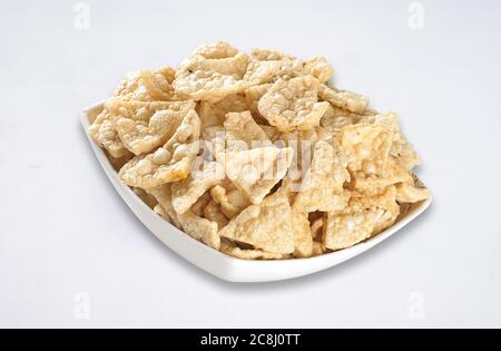 Deep fried Khichiya Papad, Traditional Indian Snacks, Indian crunchy fried snack papad or Papadam made of rice floor served in a plate. Also known as Stock Photo