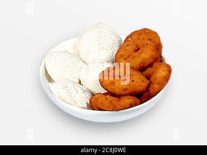 Group of South Indian food like Paper Masala Dosa (dhosa), Idli or idly, Wada or vada (Medu Vada), sambhar, sambar and coconut chutney, white backgrou Stock Photo