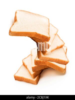 milk bread on white background, homemade slide bread on the wooden broad, Sliced bread isolated on a white background. Bread slices and crumbs viewed Stock Photo