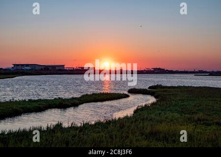 Sunset over wetlands and marsh taken at Bolsa Chica Wetland and Ecological Reserve in Huntington Beach, California, USA Stock Photo