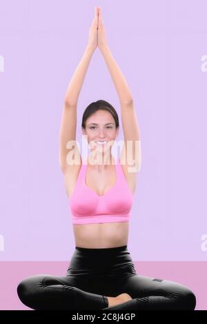 young woman practicing yoga Stock Photo