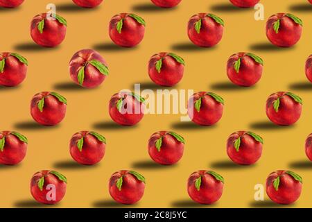 Fresh juicy peach with green leaves isolated on golden harvest background. Stock Photo