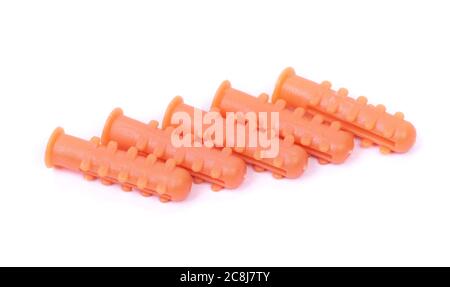 Group of plastic dowels isolated over white background Stock Photo