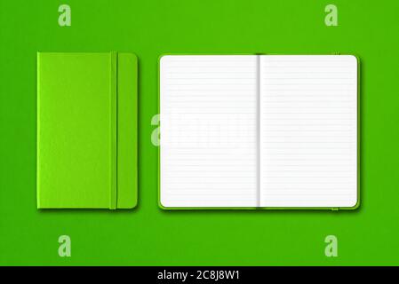 Green closed and open lined notebooks mockup isolated on colorful background Stock Photo