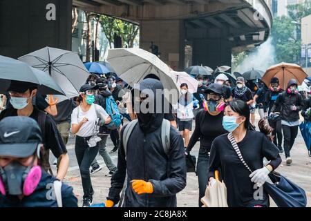 HongKong - November 18, 2019: Protesters running, fleeing from police ...