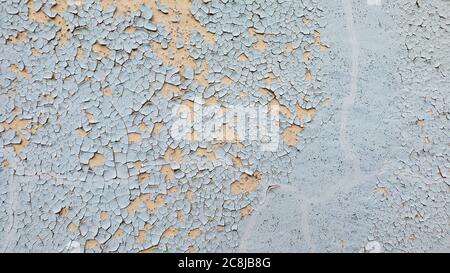 Two-colored grey beige background with cracked surface and copy space. Dry wrinkled skin and peeling concept Stock Photo