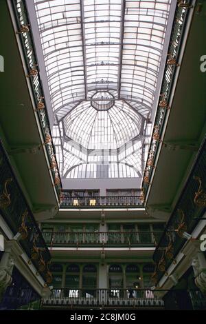 The interior of Barton Arcade, showing the elaborate Victorian glass and cast iron roof: Barton Square, Manchester, England, UK Stock Photo