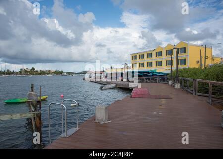 Christiansted, St. Croix, VI-October 19,2019: Boardwalk with view of harbor vessels and Rum Runners Restaurant in St. Croix in the USVI Stock Photo