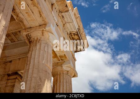 Athens Acropolis, Greece landmark. Ancient Greek Propylaea entrance gate part of ceiling and pillars low angle view, blue sky, spring sunny day. Stock Photo