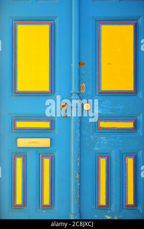 Colorful blue and yellow front door in Lisbon Stock Photo