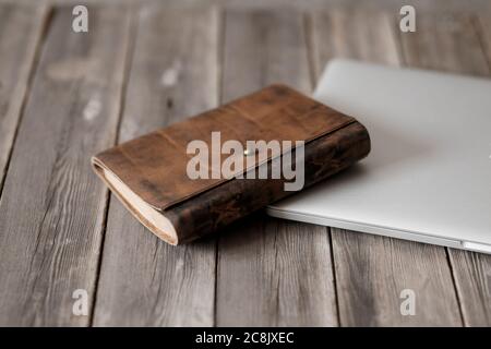 Working space, Laptop andnotepad on wooden Background desk Stock Photo