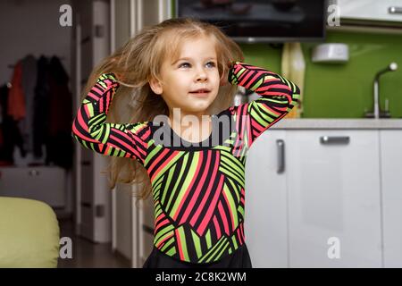 beautiful girl 4 years old in a gymnastic leotard Stock Photo