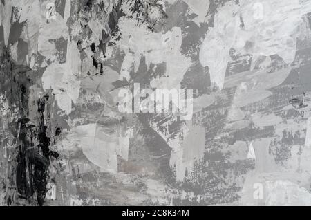 Background of wall is painted with white and gray paints, chaotic painting with facade paints, trash background. Stock Photo