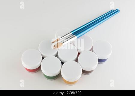 jars of colored paint for creativity on a white background Stock Photo