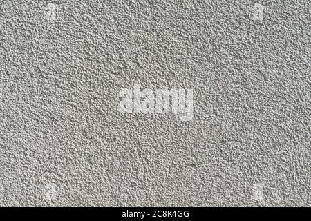 texture of an uneven painted beige rough wall Stock Photo