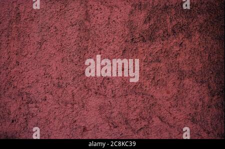 Rustic weathered dusty burgundy textured surface. Stock Photo