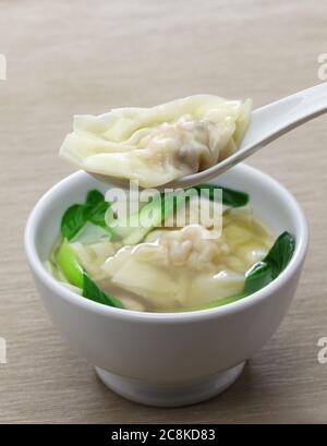 homemade wonton soup with bok choy, chinese dim sum dish Stock Photo