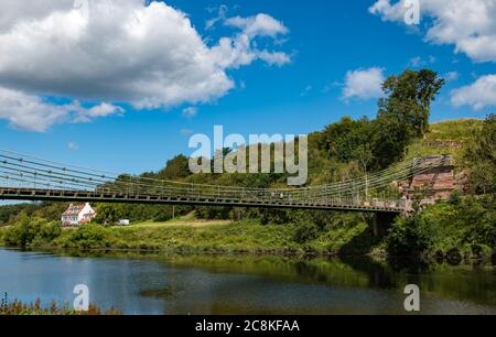 Union Suspension Bridge, 200 year old wrought iron chain bridge, English Scottish border crossing over River Tweed,, UK Stock Photo