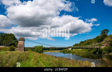 Union Suspension Bridge, 200 year old wrought iron chain bridge, English Scottish border crossing over River Tweed,, UK Stock Photo