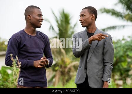 two young business people talking together outside boogie after work Stock Photo