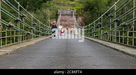 Union Suspension Bridge, 200 year old wrought iron chain bridge, English Scottish border crossing over River Tweed,, UK Stock Photo