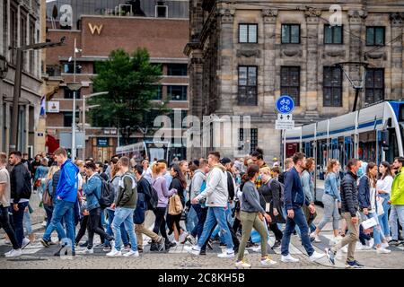 Amsterdam, Netherlands. 25th July, 2020. Crowded with tourists shopping on the streets and the Dam full of visitors with one-way traffic in the Kalverstraat, one tries to keep one and a half meters away but it is difficult amid the coronavirus threats. Credit: SOPA Images Limited/Alamy Live News Stock Photo