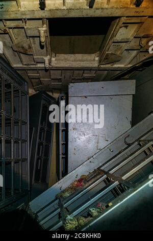 Broken electrical switchgear cabinets with control panels in abandoned bunker Stock Photo