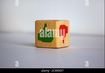 The concept of opposites, wood cube with 'ok' and ' not ok' signs on beautiful white background, flat lay, copy space. Stock Photo