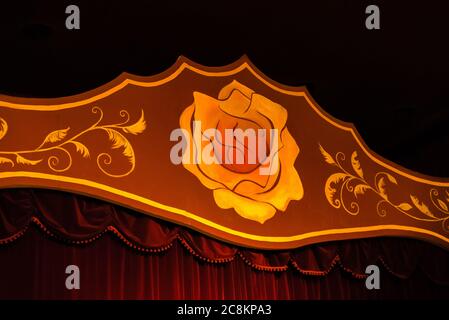 Stage with red curtains and a yellow rose. stage for shows Stock Photo