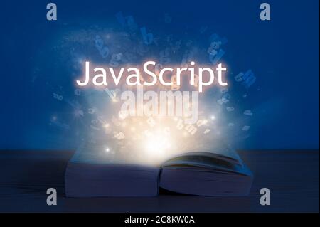 JavaScript inscription above open book. Light coming from open book with words javascript. Education concept. Stock Photo