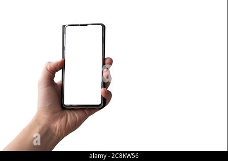 Man hand holding black mobile phone isolated on white background. Smartphone with white screen. Stock Photo