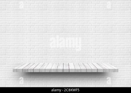 Empty white wooden shelf on old white brick wall background texture for display products. Stock Photo