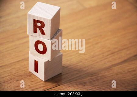 ROI letters meaning Return on Investment on wooden cubes. Business concept. Stock Photo