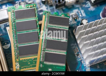 Desktop DDR RAM, against the background of a computer motherboard, closeup shot Stock Photo