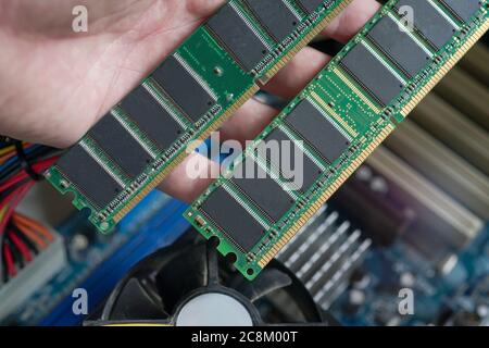 Desktop DDR RAM, against the background of a computer motherboard, closeup shot Stock Photo