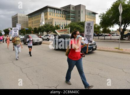San Antonio, Texas, USA. 25th July, 2020. Protesters march and caravan through downtown San Antonio, Texas during the National Day of Protest June 25. Marchers were protesting evictions, foreclosures, police brutality, and racism. Credit: Robin Jerstad/Alamy Live News Stock Photo