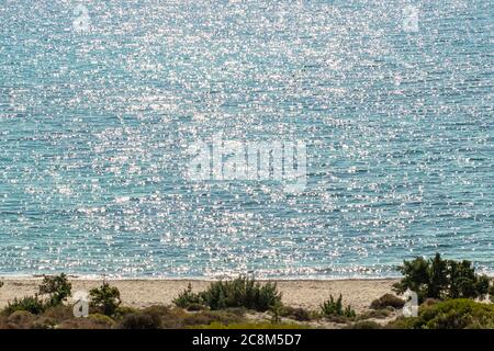 Sunlight twinkle and reflecting off water surface on the sea. Stock Photo