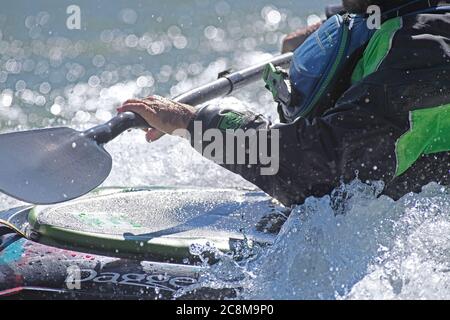 White water kayaker kayaking on the Bow River in Calgary Alberta Canada Stock Photo
