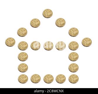 The outline of a house built from Australian one dollar coins Stock Photo