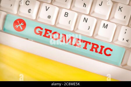 Handwriting text Geometric. Conceptual photo using straight or curved lines in designs and many more. Different colored keyboard key with accessories Stock Photo
