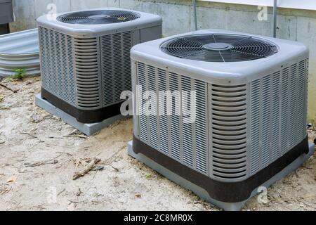 Air conditioning system unit installed outside facade of the house Stock Photo