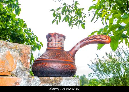 Ceramic coffee maker for preparing a coffee drink. Stock Photo