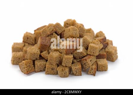 Toasted bread cubes against white background Stock Photo