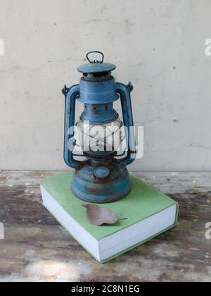Vintage Still life with ancient lantern and old book Stock Photo