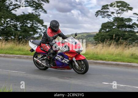 Honda Fireblade Motorbike rider; two wheeled transport, motorcycles, vehicle, roads, motorbikes, bike riders motoring in Chorley, UK Stock Photo