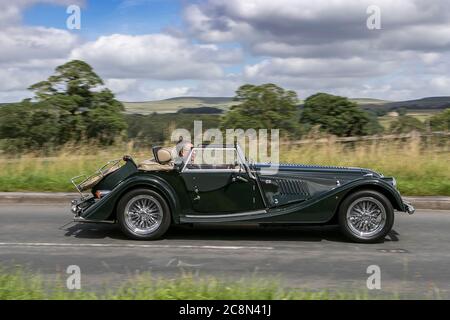 2000 green Morgan Plus 8 driving on country roads near Manchester, UK Stock Photo