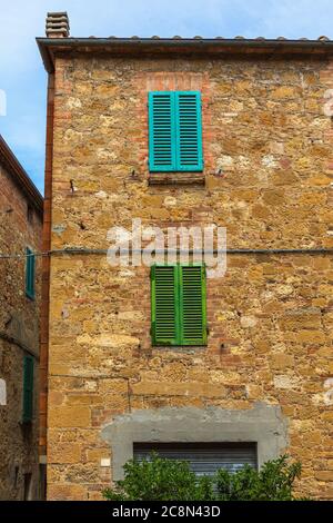 House with closed colorful shutters Stock Photo