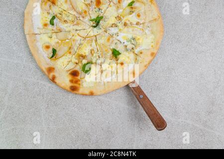 pizza with mascarpone, pear, walnuts, honey and dor blue cheese. Stock Photo