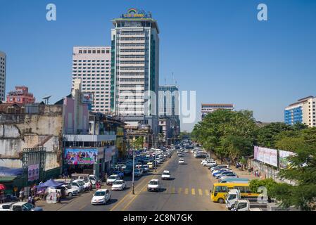 YANGON, MYANMAR - DECEMBER 18, 2016: Urban street in modern Yangon Stock Photo